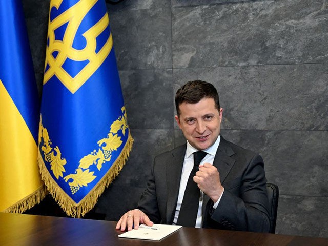Ukrainian President Volodymyr Zelensky talks to journalists in his office in Kiev on June 14, 2021 before his interview for three international agencies, including AFP, prior to a summit with US President Joe Biden and Russian President Vladimir Putin on June 16. (Photo by Sergei SUPINSKY / AFP) (Photo by …
