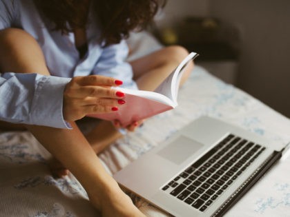 Woman on bed with laptop