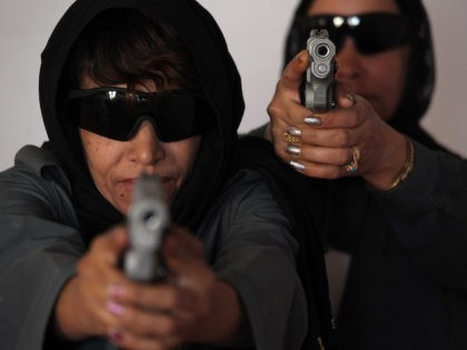 In this picture taken on June 7, 2010, female members of the Afghan National Police (ANP) aim 9mm pistols as they attend a training session in Kandahar city. In the heart of the violent city of Kandahar, birthplace of the Taliban movement, some women have resorted to taking up arms …