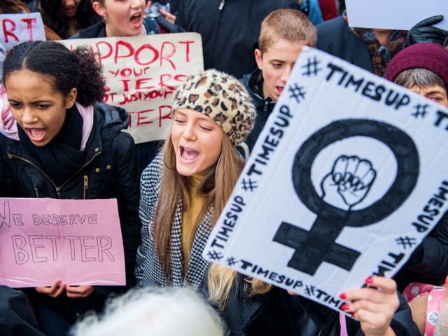 LONDON, ENGLAND - JANUARY 21: Women's rights demonstrators hold placards and shout slogans during the Time's Up rally at Richmond Terrace, opposite Downing Street on January 21, 2018 in London, England. The Time's Up Women's March marks the one year anniversary of the first Women's March in London and in 2018 it is inspired by the Time's Up movement against sexual abuse. The Time's Up initiative was launched at the start of January 2018 as a response to the #MeToo movement and the Harvey Weinstein scandal. (Photo by Chris J Ratcliffe/Getty Images)