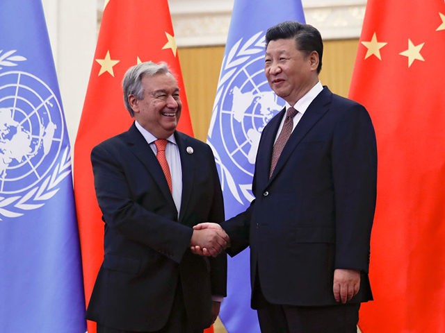 BEIJING, CHINA - SEPTEMBER 2: United Nations Secretary General Antonio Guterres, left, shakes hands with Chinese President Xi Jinping before proceed to their bilateral meeting at the Great Hall of the People on September 2, 2018 in Bejing, China. (Photo by Andy Wong-Pool/Getty Images)