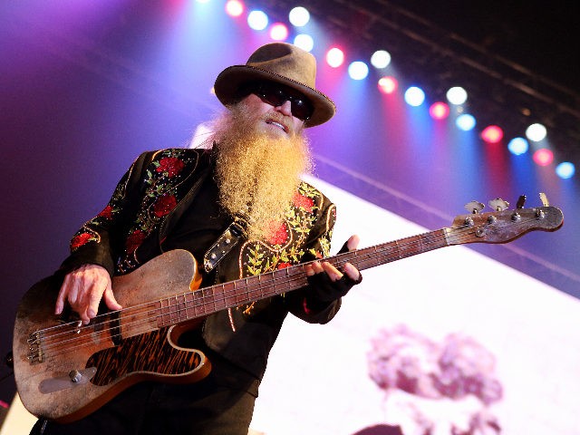 Member of the American rock band ZZ Top, Dusty Hill performs on stage during a concert on
