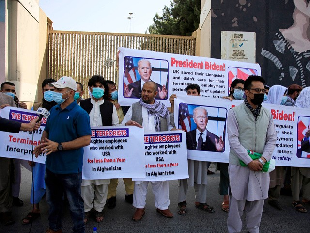 Former Afghan interpreters hold placards during a demonstrations against the US government, in front of the US Embassy in Kabul, Afghanistan, Friday, June 25, 2021. (AP Photo/Mariam Zuhaib)
