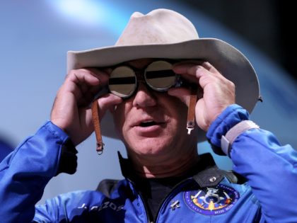 VAN HORN, TEXAS - JULY 20: Jeff Bezos holds the aviation glasses that belonged to Amelia Earhart as he speaks during a press conference about his flight on Blue Origin’s New Shepard into space on July 20, 2021 in Van Horn, Texas. Mr. Bezos said he brought the glasses with …