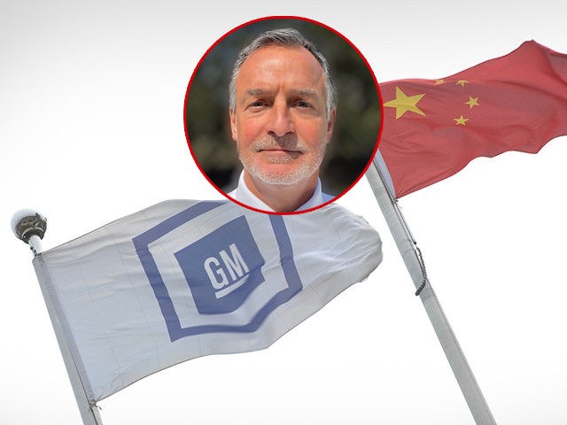 (INSET: Jeff Richetti) General Motors (GM) (L) and China (C) flags fly at its China headquarters in Shanghai on April 19, 2013. GM will launch 17 new or updated models in China this year as it seeks to maintain dominance in the world's largest car market, the US auto giant …