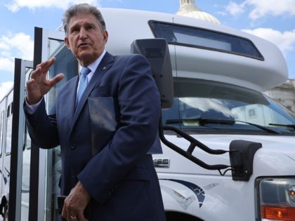 WASHINGTON, DC - JUNE 24: Sen. Joe Manchin (D-WV) talks with reporters before boarding a b