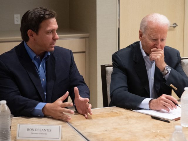 US President Joe Biden alongside Florida Governor Ron DeSantis (L) speaks about the collapse of the 12-story Champlain Towers South condo building in Surfside, during a briefing in Miami Beach, Florida, July 1, 2021. - President Joe Biden flew to Florida on Thursday to "comfort" families of people killed or …