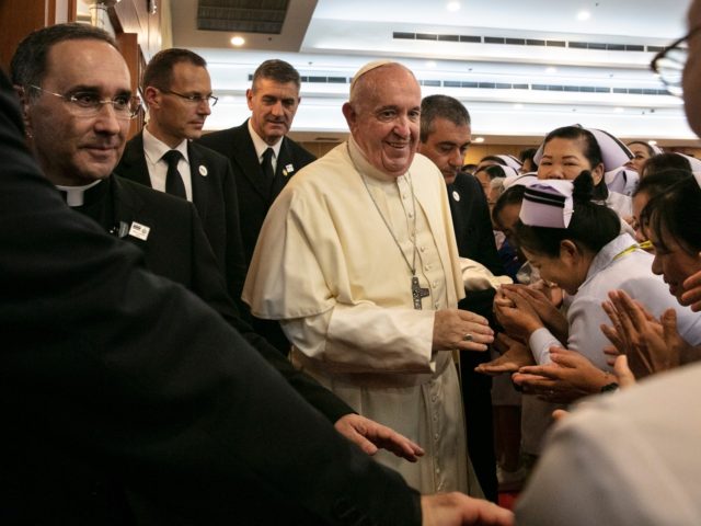 BANGKOK - NOVEMBER 21: Pope Francis greets the crowd and medical staff at the Saint Louis