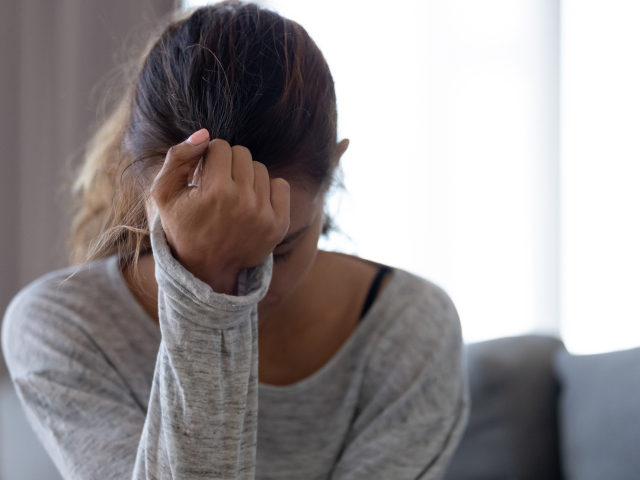 Depressed upset woman feeling hurt sad stressed troubled with problem - stock photo Depressed upset young woman feeling hurt sad stressed troubled with unwanted pregnancy, regret mistake abortion, having headache or drug addiction, suffer from grief dramatic bad problem concept