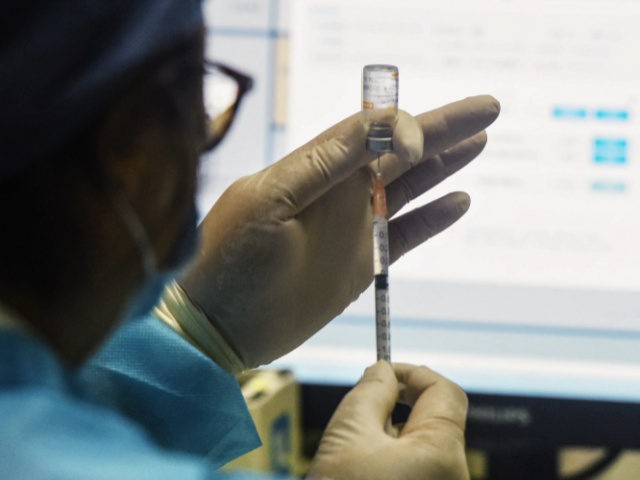 This photo taken on June 20, 2021 shows a medical worker preparing a dose of the China National Biotec Group (CNBG) Covid-19 coronavirus vaccine in Hangzhou, in China's eastern Zhejiang province. - China OUT (Photo by STR / AFP) / China OUT (Photo by STR/AFP via Getty Images)