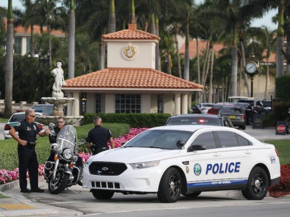 Police block off the entrance to the Trump National Doral Miami resort on May 18, 2018 in Doral, Florida. Law enforcement officials said that a man opened fire early Friday morning in the lobby of the resort and was shouting "anti-Trump rhetoric," before he was shot and wounded by police. …