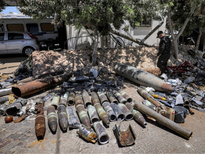Explosives experts of Hamas lay out unexploded projectiles from the aftermath of the May 2021 conflict with Israel, at a local police precinct in Gaza City on June 5, 2021. (Photo by MAHMUD HAMS / AFP) (Photo by MAHMUD HAMS/AFP via Getty Images)