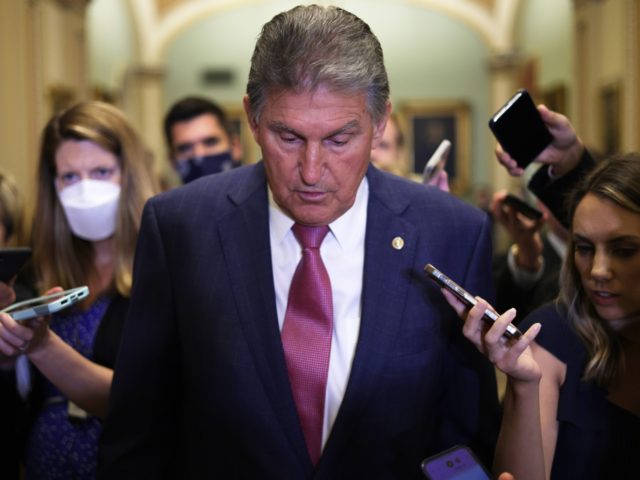 WASHINGTON, DC - JULY 27: U.S. Sen. Joe Manchin (D-WV) (C) speaks to members of the press after a weekly Senate Democratic Policy Luncheon at the U.S. Capitol on July 27, 2021 in Washington, DC. Senate Democrats held a weekly policy luncheon to discuss the Democratic agenda. (Photo by Alex …
