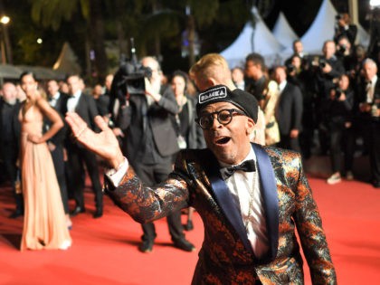 US director Spike Lee gestures as he poses on May 14, 2018 while leaving following the screening of the film "BlacKkKlansman" at the 71st edition of the Cannes Film Festival in Cannes, southern France. (Photo by LOIC VENANCE / AFP) (Photo credit should read LOIC VENANCE/AFP via Getty Images)