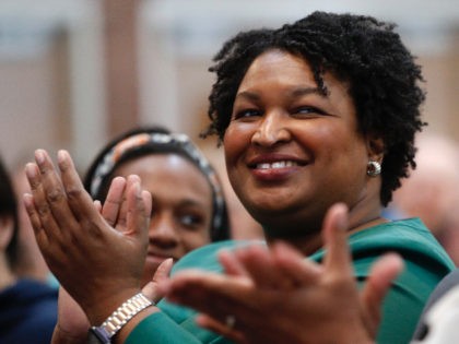 Stacey Abrams, a Georgia Democrat who has launched a multimillion-dollar effort to combat voter suppression, applauds a dignitary at the University of New England, Wednesday, Jan. 22, 2020 in Portland, Maine. Abrams was a Georgia state legislator who became the first black woman to win a major party gubernatorial nomination …