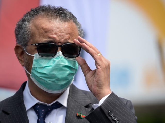 World Health Organization (WHO) Director-General Tedros Adhanom Ghebreyesus adjusts his glasses during a meeting with Doctors for Extinction Rebellion in front of the WHO headquarters during a protest on the sideline of the WHO's World Health Assembly in Geneva on May 29, 2021. - Hundreds of health workers marched to …