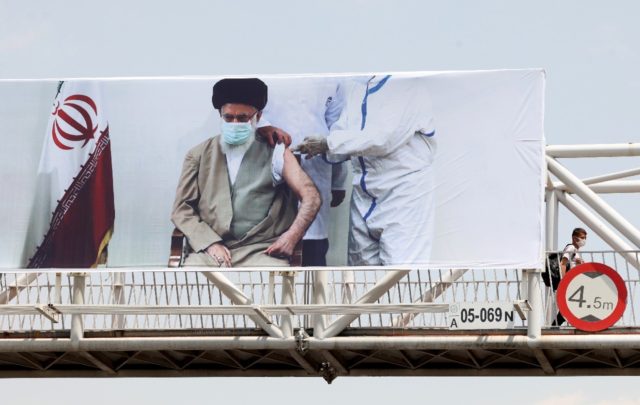 An overpass in Tehran bears a banner showing Iran's supreme leader Ayatollah Ali Khamenei