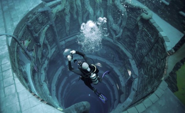 A diver experiences Deep Dive Dubai, the deepest swimming pool in the world