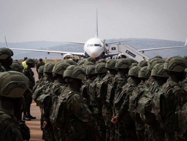 Europe's mission adds to international efforts to help Mozambique tackle the jihadist insurgency in the north of the country. Above: Rwandan troops and policemen who left for the region on Saturday