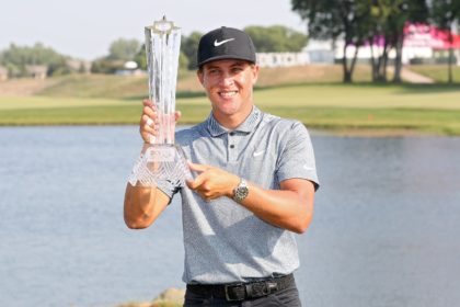 Cameron Champ poses with the trophy after earning $1.2 million for winning the 3M Open at the Twin Cities course in Blaine, Minnesota
