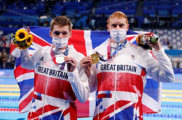 Britain's Tom Dean (R) and Duncan Scott won gold and silver medals in the men's 200m frees