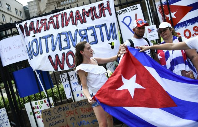 Crowds gather outside the Cuban embassy in Washington in support of anti-government protes