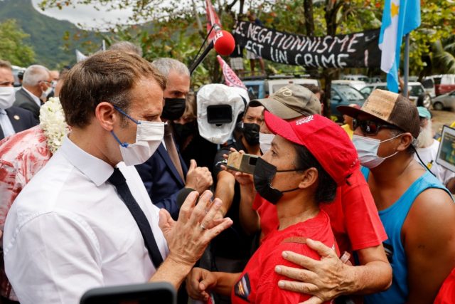French President Emmanuel Macron stopped by the side of the road to talk to anti-nuclear p