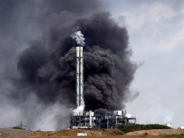 Smoke rises from a landfill and waste incineration area at the Chempark industrial park run by operator Currenta following an explosion in Leverkusen in western Germany, on July 27, 2021 At least 16 people were injured and five missing after an explosion at the chemical park in Leverkusen, western Germany, …