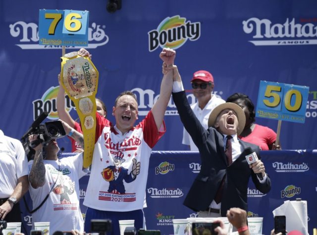 Joey Chestnut relishes Nathan's record 76 hot dogs in 10 ...