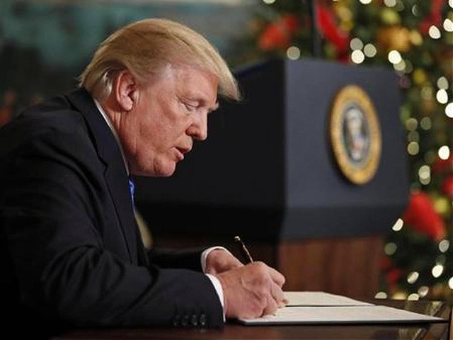 President Donald Trump signs a proclamation in the Diplomatic Reception Room of the White House, Wednesday, Dec. 6, 2017, in Washington. Trump recognized Jerusalem as Israel's capital despite intense Arab, Muslim and European opposition to a move that would upend decades of U.S. policy and risk potentially violent protests. (AP Photo/Alex Brandon)