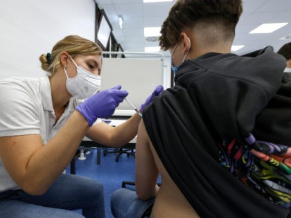 A student gets a coronavirus vaccine