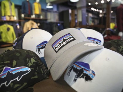 This photo shows the Patagonia logo on items in the brand section of a retail department store Wednesday, Nov. 28, 2018, in New York. Patagonia, an outdoor gear company, is passing along the $10 million it saved from tax cuts to non-profit environmental groups. (AP Photo/Bebeto Matthews)