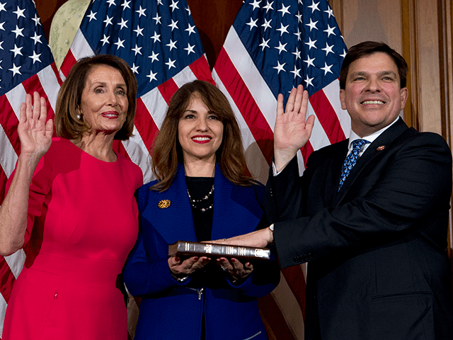 House Speaker Nancy Pelosi of Calif., administers the House oath of office to Rep. Vicente Gonzalez, D-Texas., during a ceremonial swearing-in on Capitol Hill in Washington, Thursday, Jan. 3, 2019, during the opening session of the 116th Congress. (AP Photo/Jose Luis Magana)