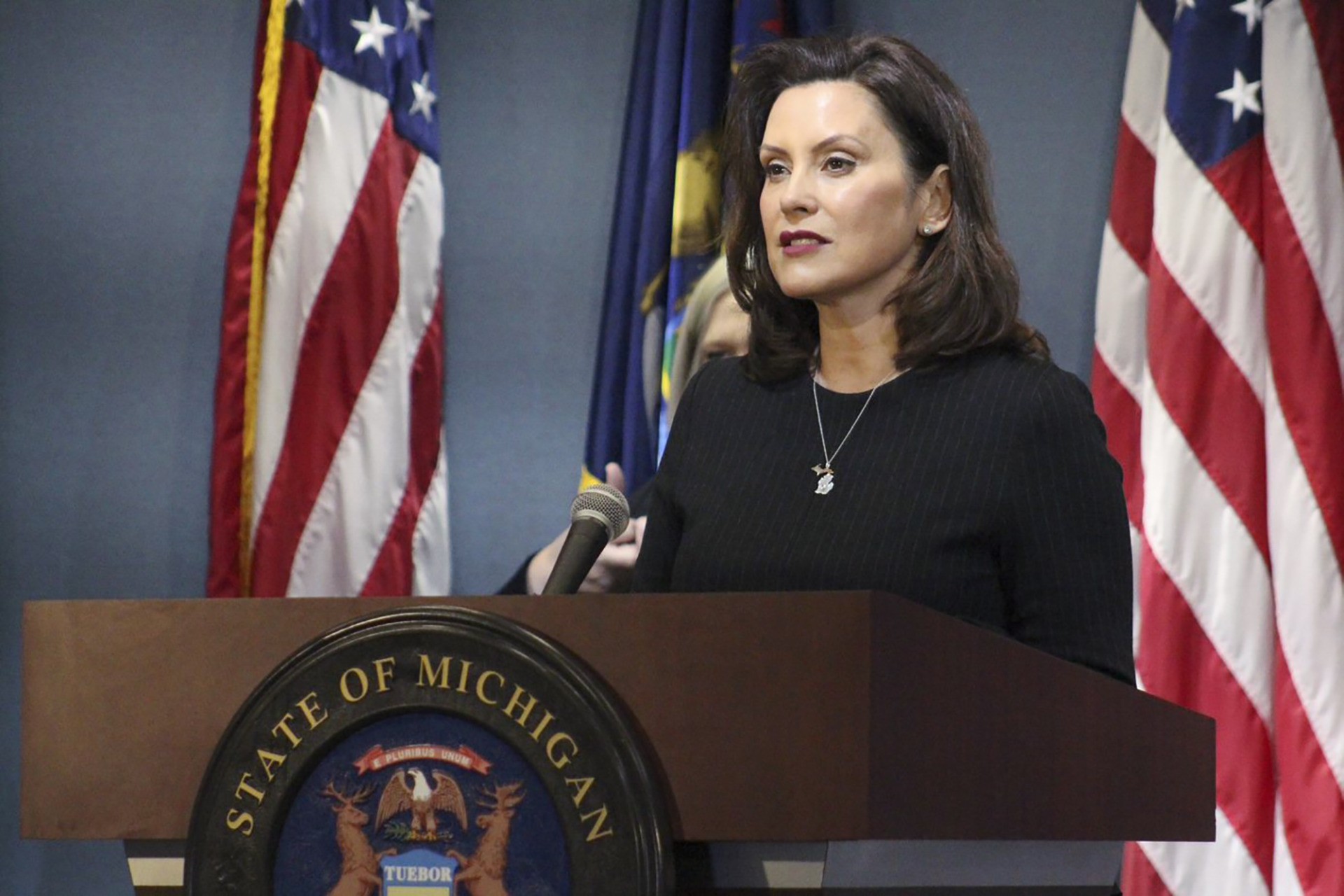This photo provided by the Michigan Office of the Governor, Michigan Gov. Gretchen Whitmer addresses the state during a speech in Lansing, Mich., Wednesday, April 29, 2020. The governor on Wednesday proposed free college for health care workers and others involved in the coronavirus fight, likening their service during the pandemic to soldiers who got a free education after returning home from World War II. (Michigan Office of the Governor via AP, Pool)