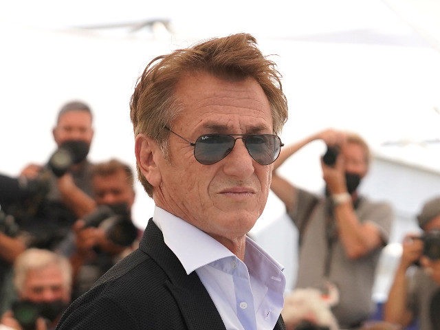 Sean Penn poses for photographers at the photo call for the film 'Flag Day' at the 74th international film festival, Cannes, southern France, Sunday, July 11, 2021. (AP Photo/Brynn Anderson)