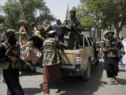 Taliban fighters patrol in Kabul, Afghanistan, Thursday, Aug. 19, 2021. The Taliban celebr