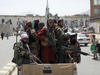 Taliban fighters patrol in Kabul, Afghanistan, Thursday, Aug. 19, 2021. The Taliban celebr