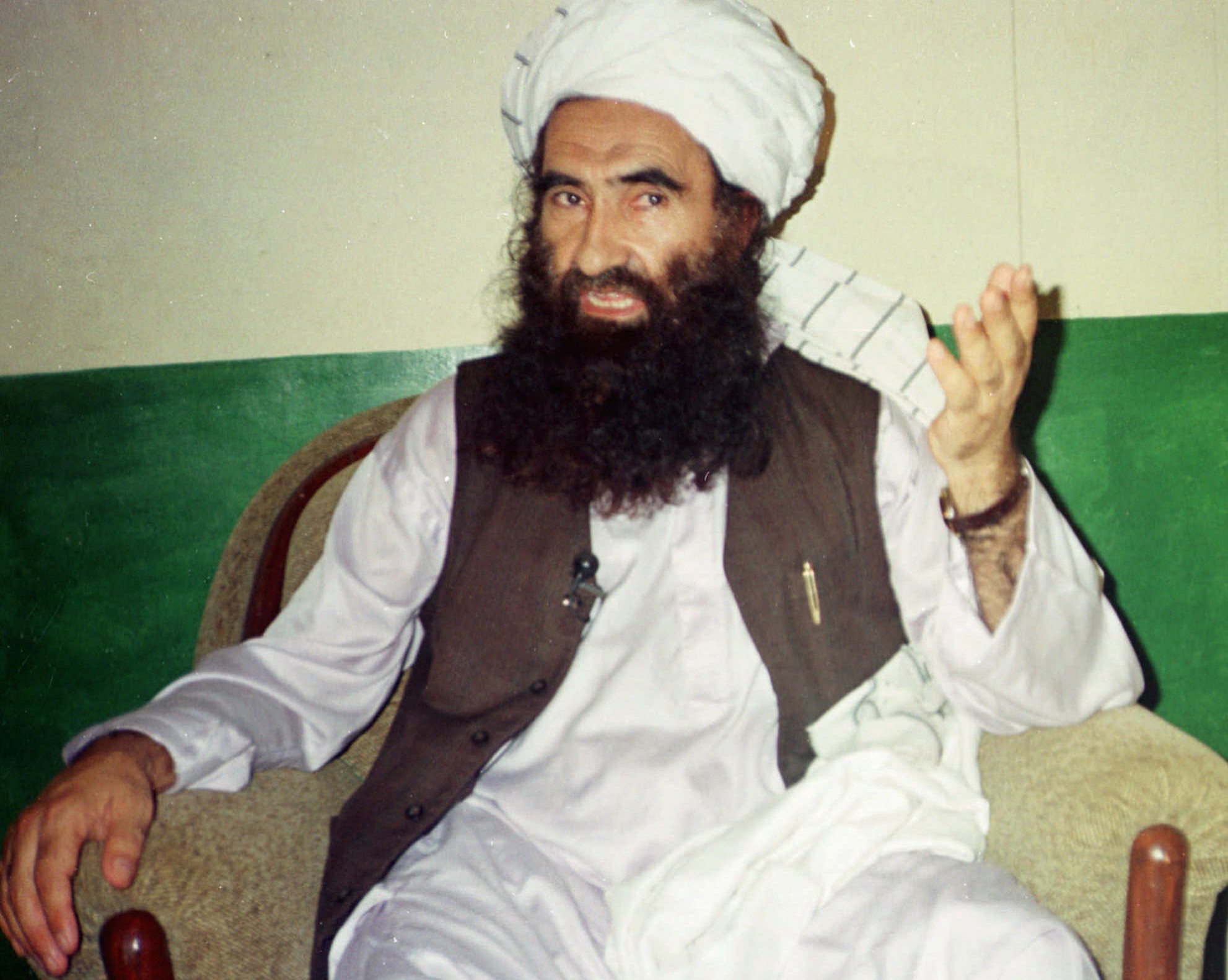 FILE - In this Saturday Aug. 22, 1998 file photo, Jalaluddin Haqqani, then Taliban Army Supreme Commander, speaks during an interview in Miram Shah, Pakistan. Al-Qaida has maintained longtime ties with a number of key figures within the broad coalition that is fighting U.S. and NATO forces in Afghanistan. Chief among them are Haqqani and his son Sirajuddin, whose Pakistan-based forces are battling the Americans and their allies across eastern Afghanistan. (AP Photo/Mohammed Riaz, file)