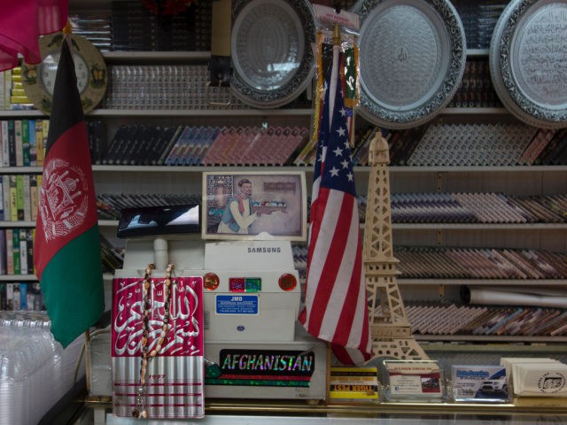 The cash register at Kouchi Super Market in the borough of Queens displays flags from the US as well as Afghanistan June 13, 2016 in New York. - There are an estimated 80,000 to 300,000 Afghan Americans. The largest communities are in California and Virginia, but thousands more live in …