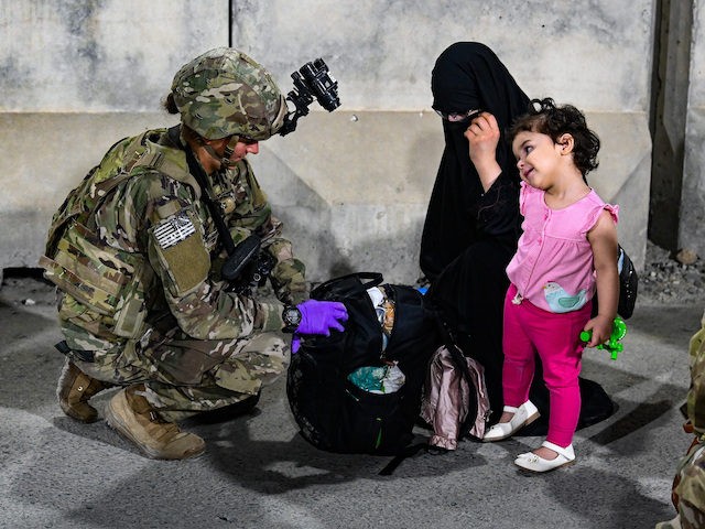 Paratroopers assigned to the 1st Brigade Combat Team, 82nd Airborne Division, based out of Fort Bragg, N.C., facilitate the safe evacuation of U.S. citizens, Special Immigrant Visa applicants, and other at-risk Afghans out of Afghanistan as quickly and safely as possible from Hamid Karzai International Airport in Kabul, Aug 22. …