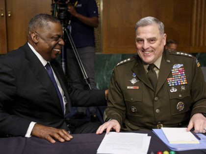US Defense Secretary Lloyd Austin (L) laughs with Chairman of the Joint Chiefs of Staff Gen. Mark Milley before their testimony at a Senate Committee on Appropriations hearing on the 2022 budget for the Defense Department, on Capitol Hill in Washington, DC, June 17, 2021. (Photo by EVELYN HOCKSTEIN / …