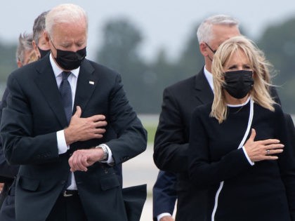TOPSHOT - US President Joe Biden looks down alongside First Lady Jill Biden as they attend the dignified transfer of the remains of a fallen service member at Dover Air Force Base in Dover, Delaware, August, 29, 2021, one of the 13 members of the US military killed in Afghanistan …