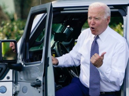President Joe Biden talks after driving Jeep Wrangler 4xe Rubicon on the South Lawn of the