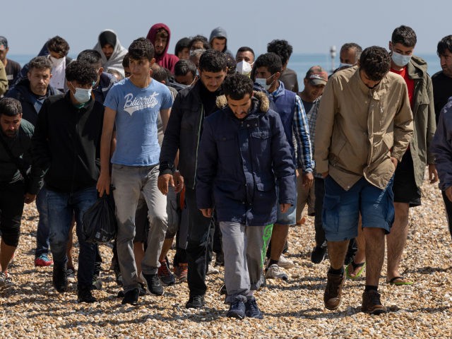 DUNGENESS, ENGLAND - AUGUST 04: A group of around 40 migrants arrive via the RNLI (Royal N