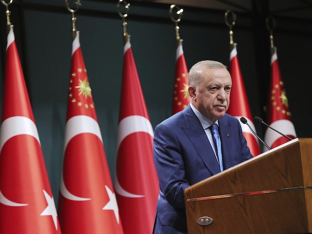 Turkish President Recep Tayyip Erdogan speaks during a televised address following a cabinet meeting, in Ankara, Turkey, Thursday, Aug. 19, 2021. Faced with a potential new wave of migrants from Afghanistan, Erdogan called on European nations on Thursday to shoulder the responsibility for Afghans fleeing a Taliban onslaught and warned …