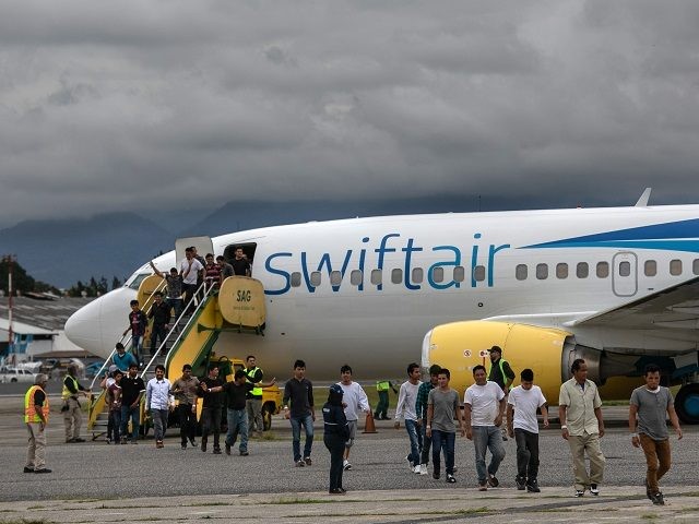 GUATEMALA CITY, GUATEMALA - MAY 30: Guatemalan men walk from a deportation flight, chartered by the U.S. Government, after being sent back from the United States on May 30, 2019 in Guatemala City, Guatemala. U.S. Immigration and Customs Enforcement (ICE) deports some 2,000 people per week to Guatemala from various …