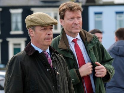HARTLEPOOL, ENGLAND - NOVEMBER 11: Brexit Party leader Nigel Farage (L) stands with Brexit party chairman and parliamentary candidate for Hartlepool, Richard Tice as they hold a press visit to wartime memorials on Hartlepool Headland during a visit to the town with the Brexit Party general election campaign tour on …