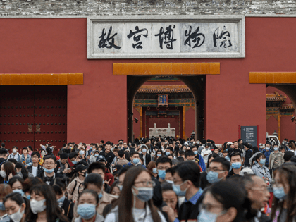 Chinese tourists crowd as they leave the exit of the Forbidden City on October 6, 2020 aft