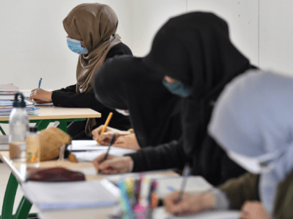 Students attend a Koran study class at the European Institute of Social Sciences (Institut Europeen des Sciences Humaines, IESH) in Saint-Leger-de-Fougeret, central France on October 28, 2020. - The IESH Institute,inaugurated in 1992, was the first of its kind in France, on the electoral grounds of François Mitterrand, who already …