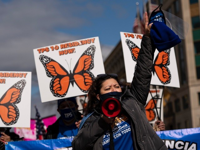 WASHINGTON, DC - FEBRUARY 23: Activists and citizens with temporary protected status (TPS) march along 16th Street toward the White House in a call for Congress and the Biden administration to pass immigration reform legislation on February 23, 2021 in Washington, DC. Last week, Democrats in Congress unveiled a wide-ranging immigration reform bill, including an expedited path to citizenship for undocumented young people who arrived in the U.S. as children with temporary protected status under DACA. (Photo by Drew Angerer/Getty Images)